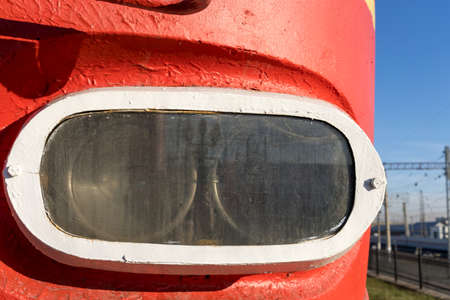 Headlight of a locomotive that stands at the railway stationの写真素材