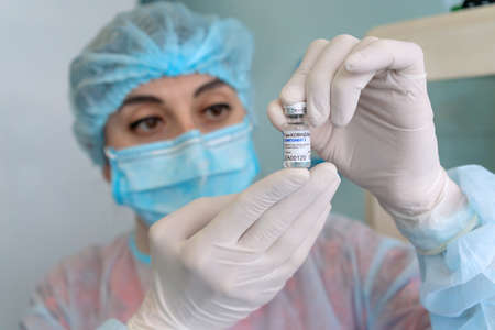 Nurse checks vaccine status for infection vaccination. Russian Federation, January 2021のeditorial素材