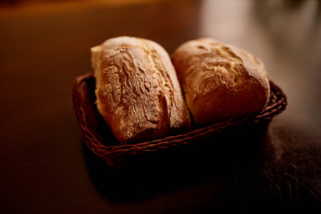 Delicious freshly baked huge ciabatta bread on a table.