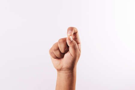 Letter T of the alphabet of sign language isolated on white backgroundの写真素材