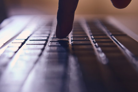 Man hands typing on laptop keyboard. on a desk