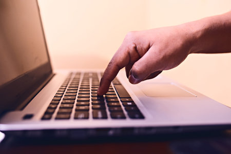 Man hands typing on laptop keyboard. on a desk