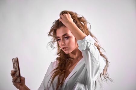 Beautiful young woman is making selfie photoの写真素材