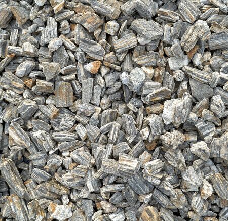 Mix size crushed rock on surface texture.Stones small size. Rocks wall textureの写真素材
