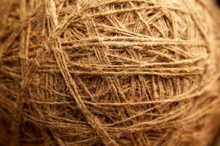 Ball of grey natural linen string top view.Linen rough threads, old shabby rustic background textureの写真素材
