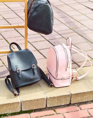 school bags backpacks are on the sidewalkの写真素材