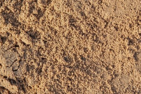 Macro shot of wet sand, for texture or backgroundの写真素材