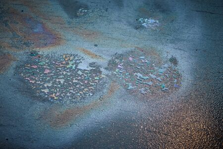 Oily Rainbow Swirl of Neon Colors on Pavement. Great Background!の写真素材