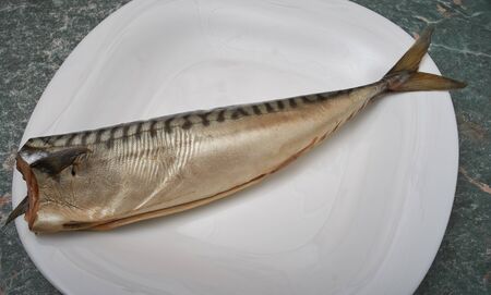 cold-smoked mackerel on a white plateの写真素材