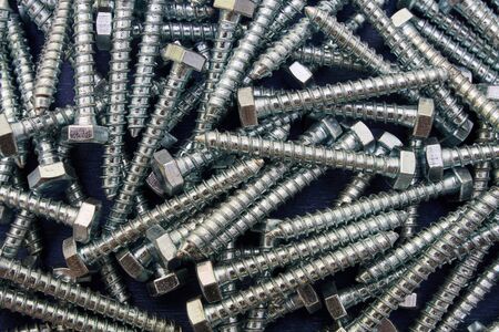 Galvanized screws on a blue background.Turnkey wood screwsの写真素材