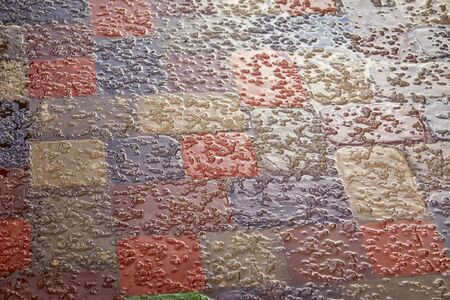 Sidewalk tiles covered with and ice.Background of a snow-covered sidewalk close-up.Selective focusの写真素材