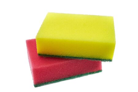 Two sponges for cleaning from contaminations of red and yellow color with a thin layer of abrasive polymer.Isolated on white backgroundの写真素材