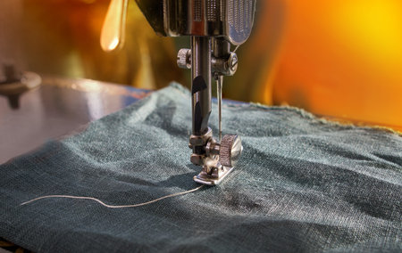 Closeup the sewing machine and item of clothing, old sewing machine,vintage style