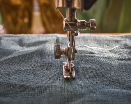 Closeup the sewing machine and item of clothing, old sewing machine,vintage styleの写真素材
