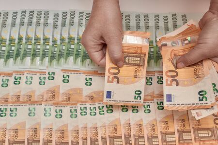 Background Euro money in hand, a variety of currenciesの写真素材