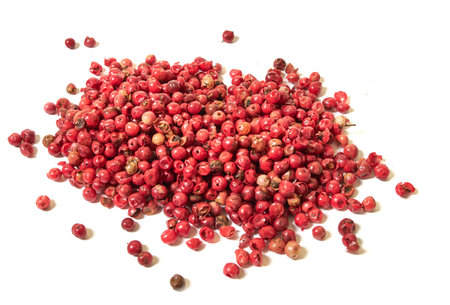 pink peppercorns seeds isolated on white background. Top view.