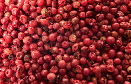 Pink pepper brazilian red peas top view, texture, background.