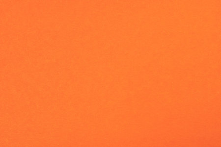 Texture of bright orange paper as backgroundの写真素材