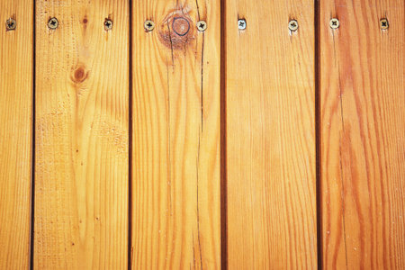 Wooden slats background enshrined with screws