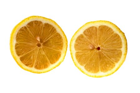 Round slices of yellow ripe lemon fruit, isolated on a white backgroundの写真素材