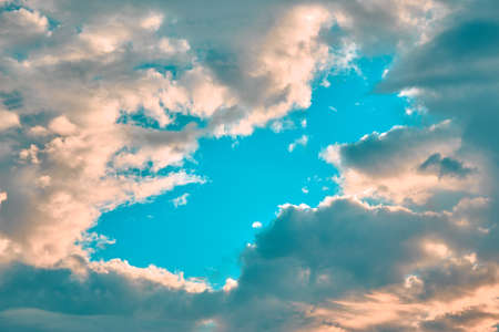 Blue sky in the center with clouds at the edgesの写真素材