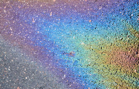 Oil stain on asphalt as texture or background.Environmental pollution concept.の写真素材