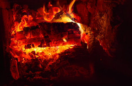 Burning firewood in the stove. Soft selective focusの写真素材