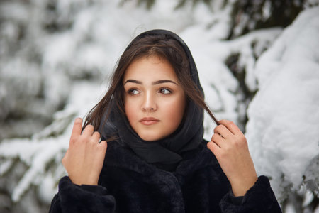 close up winter portrait of dreamy young woman