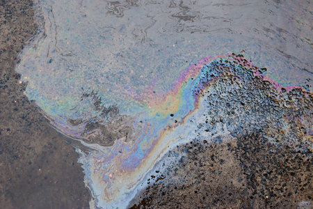 Gasoline stain on Asphalt, color Oil fuel spots on Asphalt Road as Texture or Background