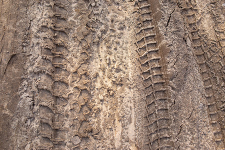 drawing of car tires on the sandの写真素材