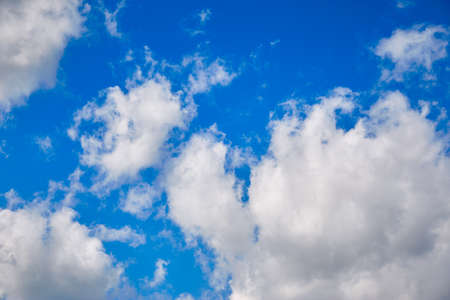 white clouds against the blue spring skyの写真素材