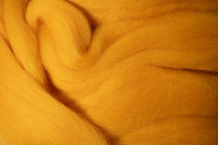 Wool texture closeup. Detailed texture with natural yellow wool