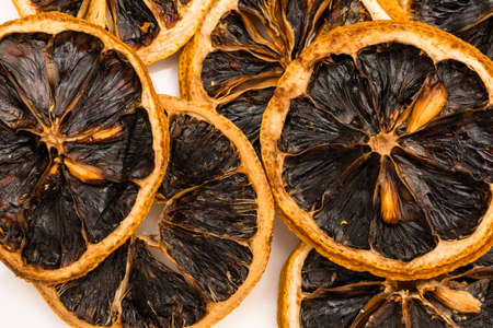 Natural dried grapefruit background. Sliced and dried grapefruit wedges as a background. Food background.の写真素材