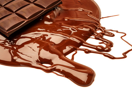 Melted pieces of chocolate bar in splash. Melted chocolate background isolate on white background. Melting Chocolate. Chocolate backgroundの写真素材