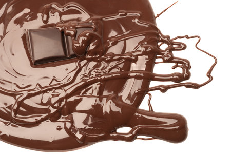 Melted pieces of chocolate bar in splash. Melted chocolate background isolate on white background....