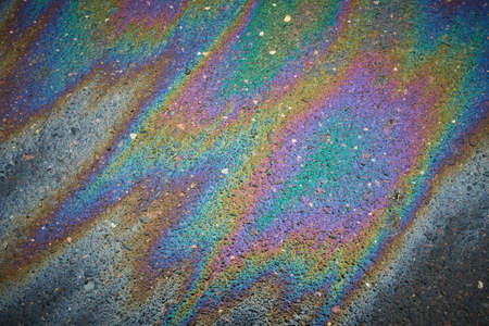 Color Gasoline fuel spots on Asphalt Road as Texture or Background. Environmental pollution conceptの写真素材