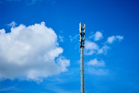 Wireless Communication Antenna With bright sky. Wireless Communication Antenna Transmitter. 3G and...