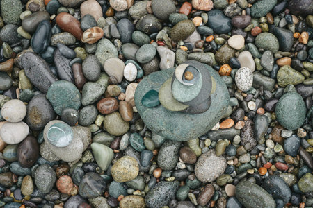 The stones, stacked one after the other, balance the rocks on the seashore. Balancing stones on a...