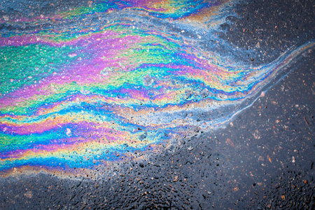 Abstract Color Gasoline fuel spots on Asphalt Road as Texture or Background. environmental pollution conceptの写真素材