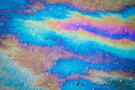 Oil stain, Gas Stain drop from the Car on the Parking Lot Floor. Environmental pollution concept