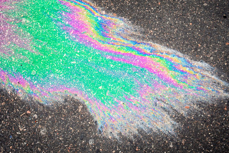 Leaked petroleum products on the roadway. abstract rainbow backgroundの写真素材