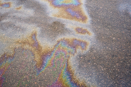 Oil stain, Gas Stain drop from the Car on the Parking Lot Floor. Environmental pollution conceptの写真素材