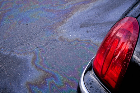 Engine oil stains of car. Leak under the car when the car is park. Selective focusの写真素材
