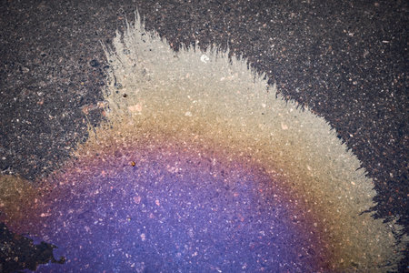 Oil stain, Gas Stain drop from the Car on the Parking Lot Floorの写真素材
