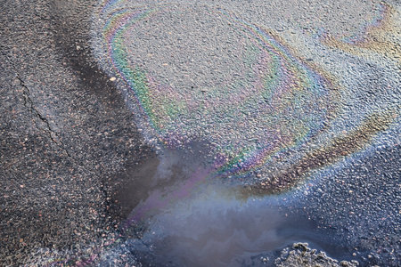 Oil stain on Asphalt, color Gasoline fuel spots on Asphalt Road as Texture or Backgroundの写真素材