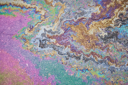 A puddle of leaked petroleum product on the highway. Gasoline stains on asphalt.の写真素材