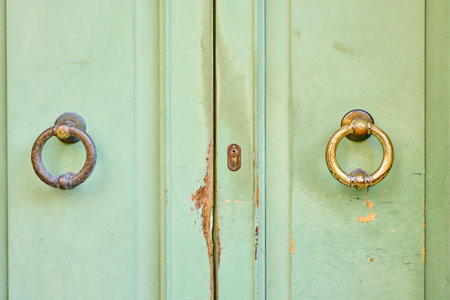 close up old green door with doorknob in vintage style.