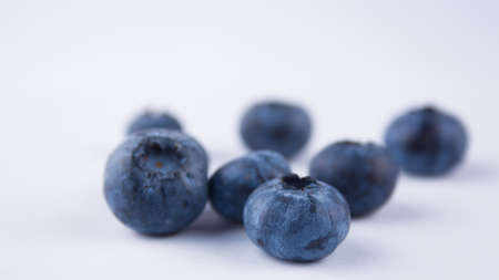 Close-up of ripe juicy blueberries on a white background.の写真素材