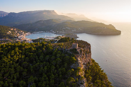 Picturesque aerial view coastline Port de Soller, Mallorca, featuring historic Torre Picada...