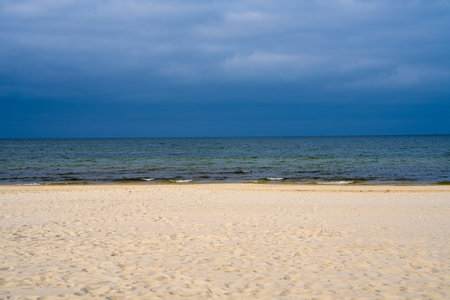 Coastline. White sand, Baltic Sea under blue skyの写真素材
